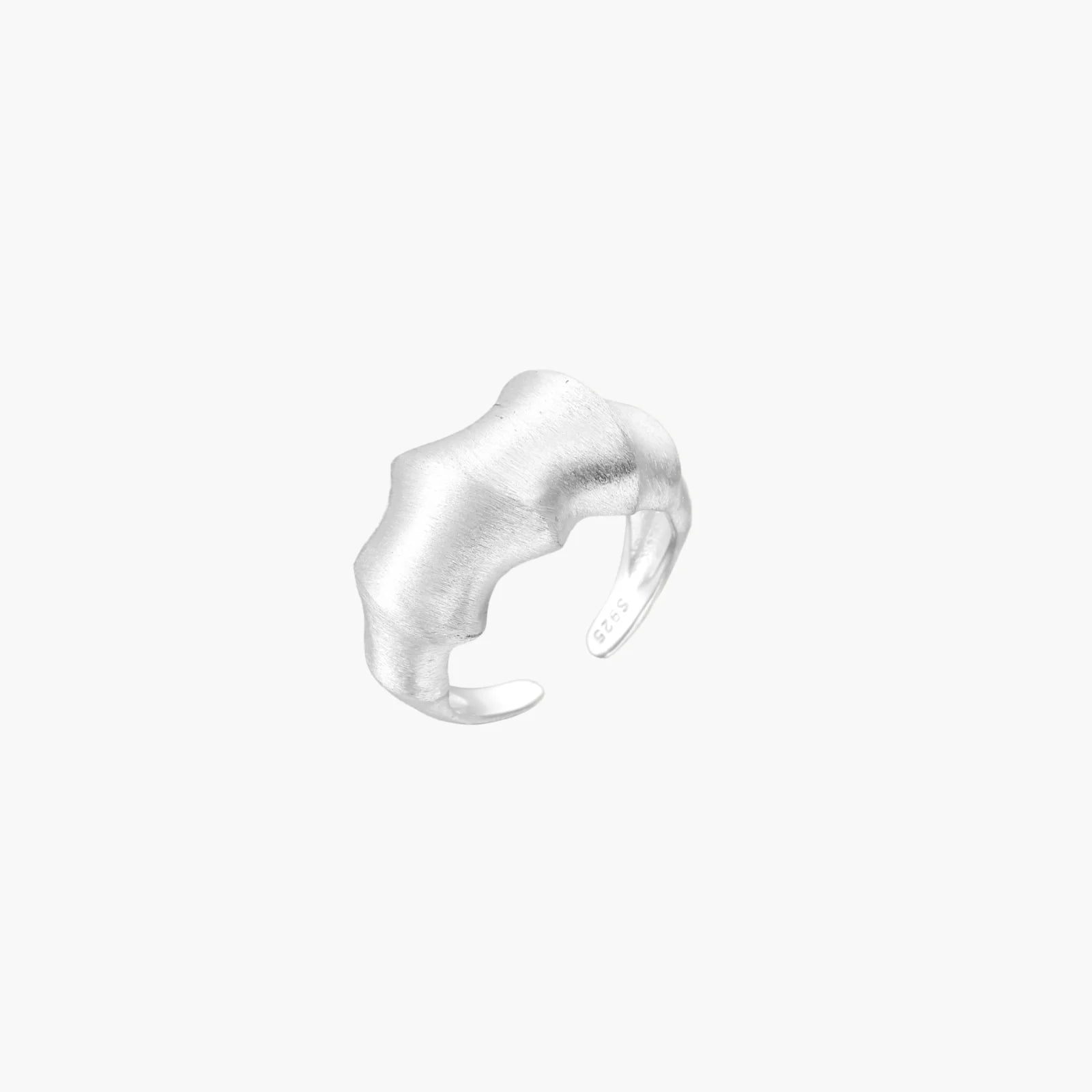 Brushed sterling silver ring with organic wave-like edges and adjustable cuff design on white background
