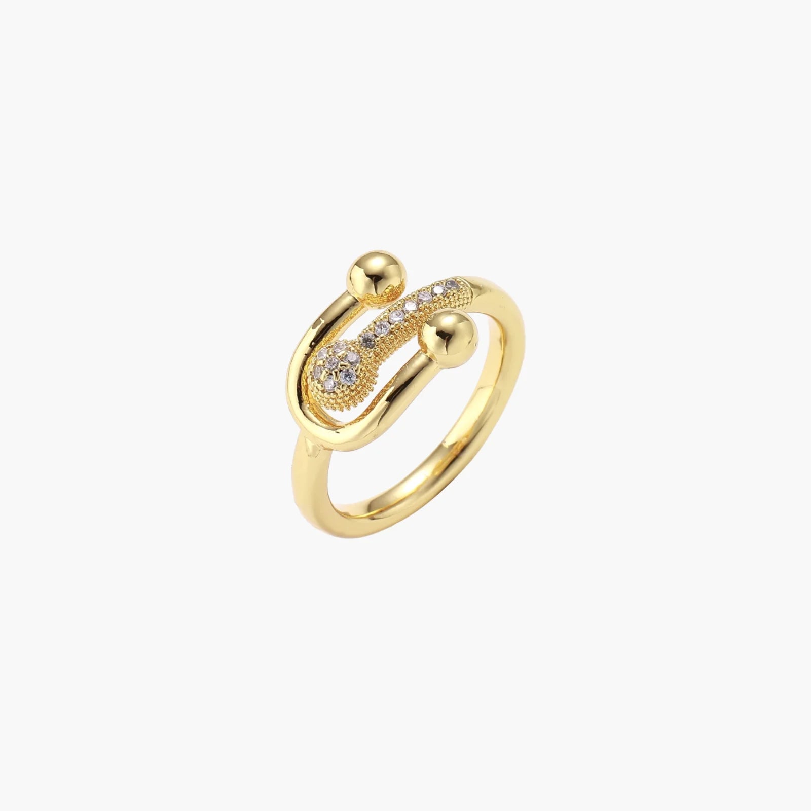 Gold-plated brass ring with safety pin design featuring pavé cubic zirconia stones and dual sphere ends