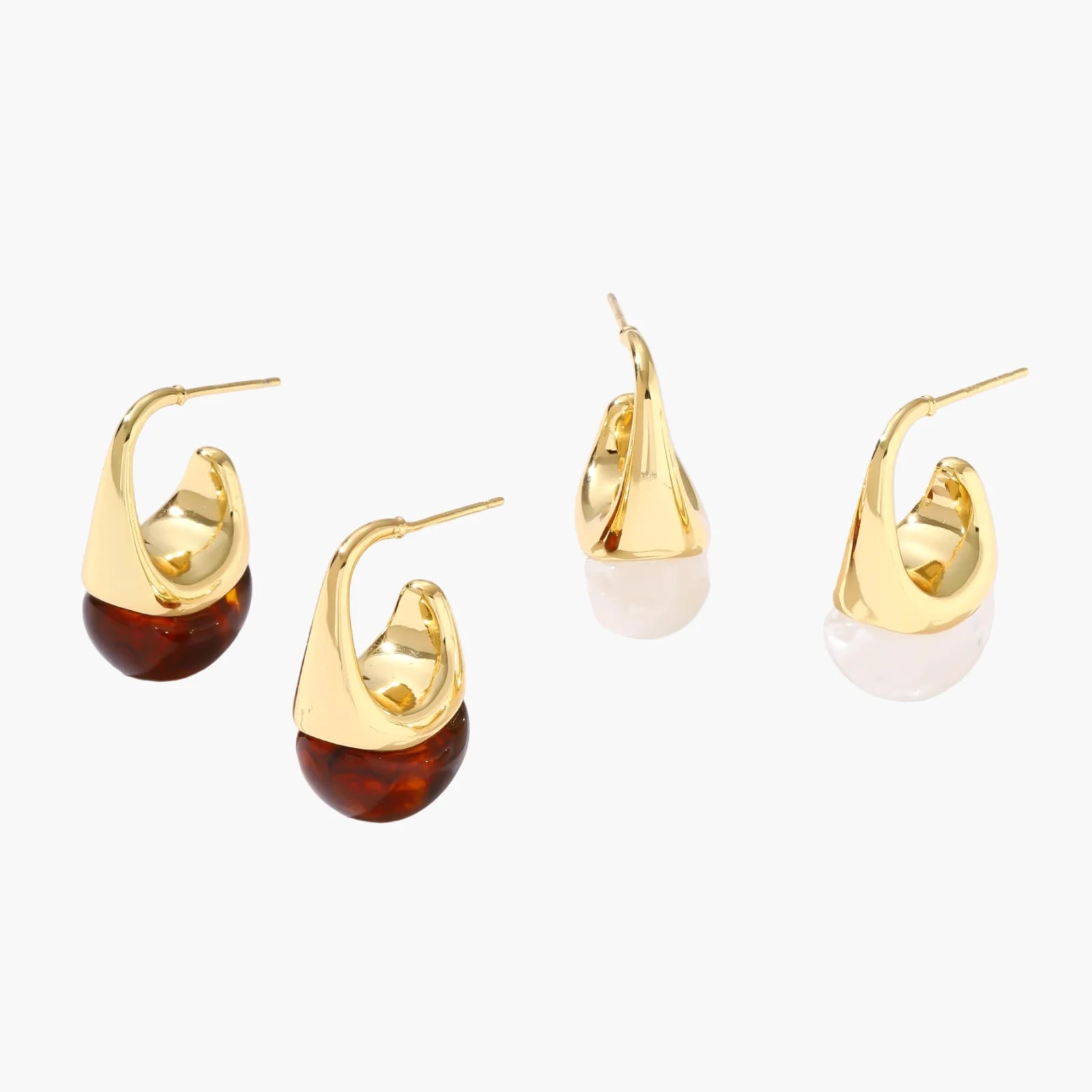 Modern drop earrings with curved gold-plated copper tops and amber resin bottoms creating an organic teardrop silhouette.