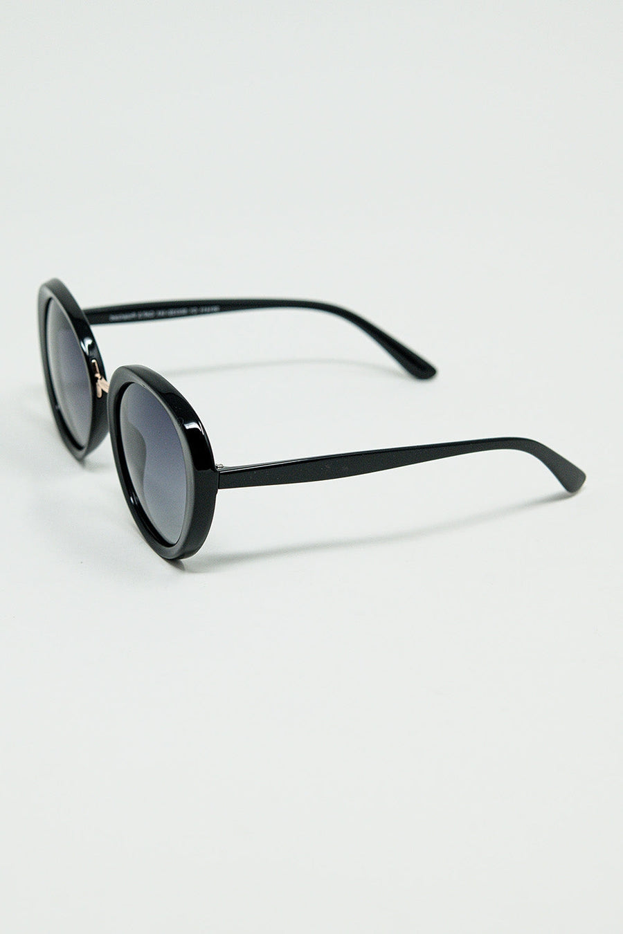 Black Oval Shaped Sunglasses With Metal Gold Detail